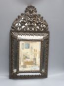 A 19th century Dutch embossed copper mounted wall mirror 58cm