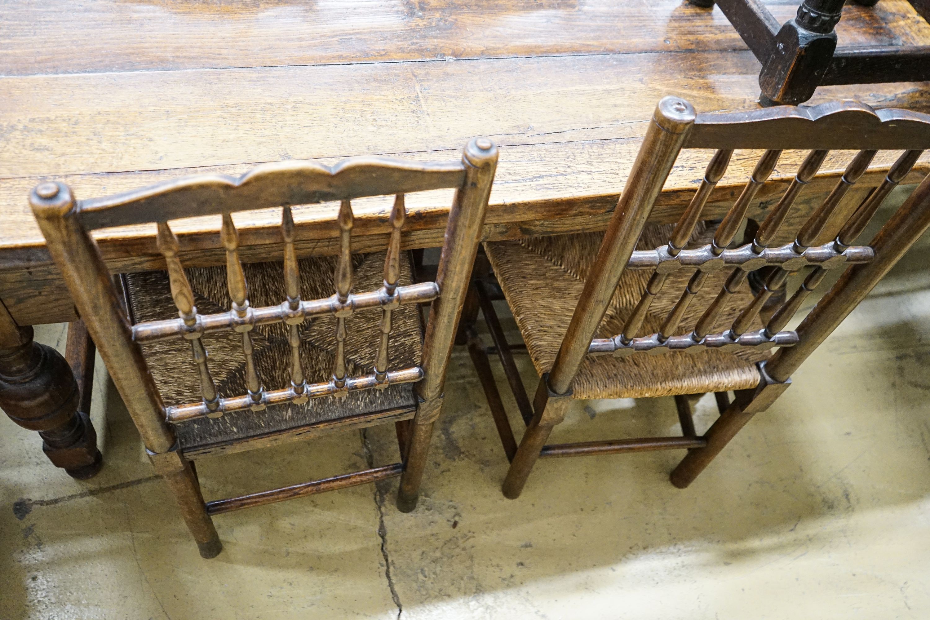 A harlequin set of five oak, elm and beech spindle back chairs, with rush seats and a similar - Image 4 of 4