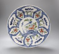 An 18th century Delft polychrome dish 35cm