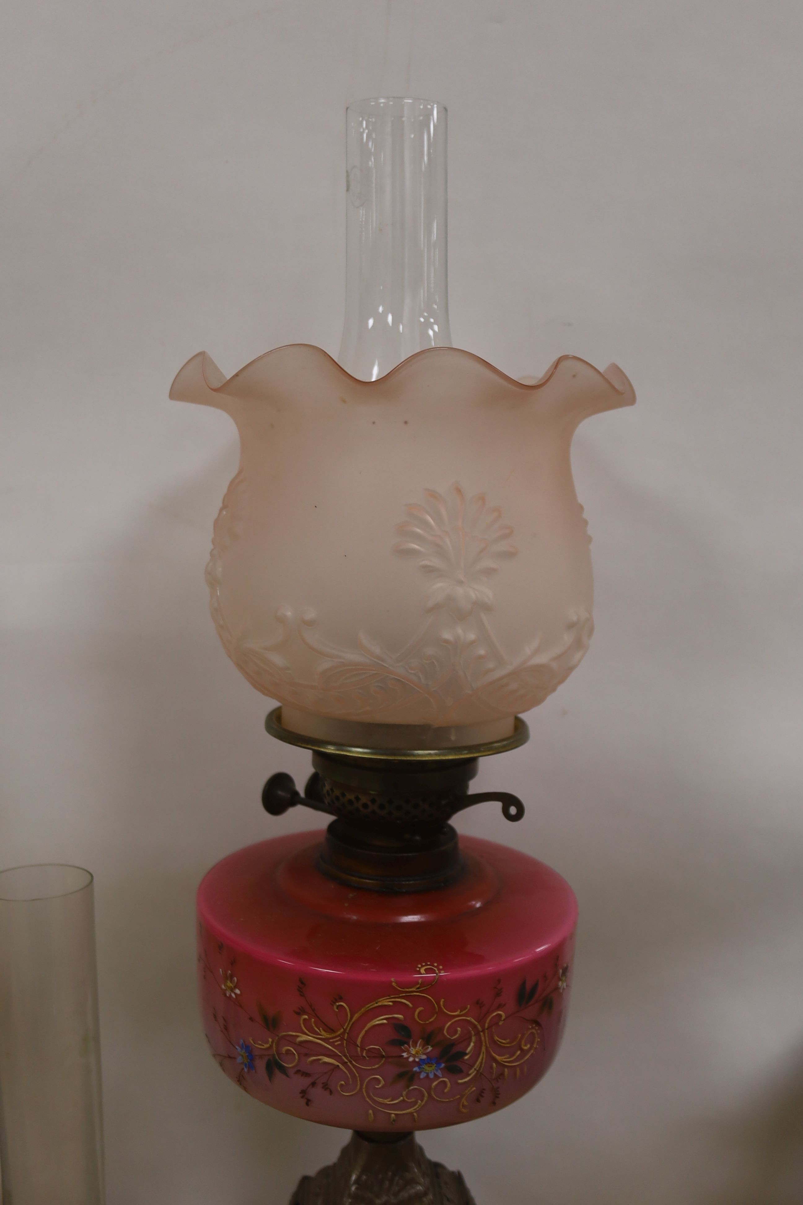 Two late Victorian brass mounted oil lamps with pink and yellow tinted glass reservoirs, tallest - Image 3 of 4