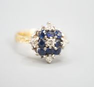 A 1960's 18ct gold, sapphire and diamond cluster ring, size Q, gross weight 5.8 grams.