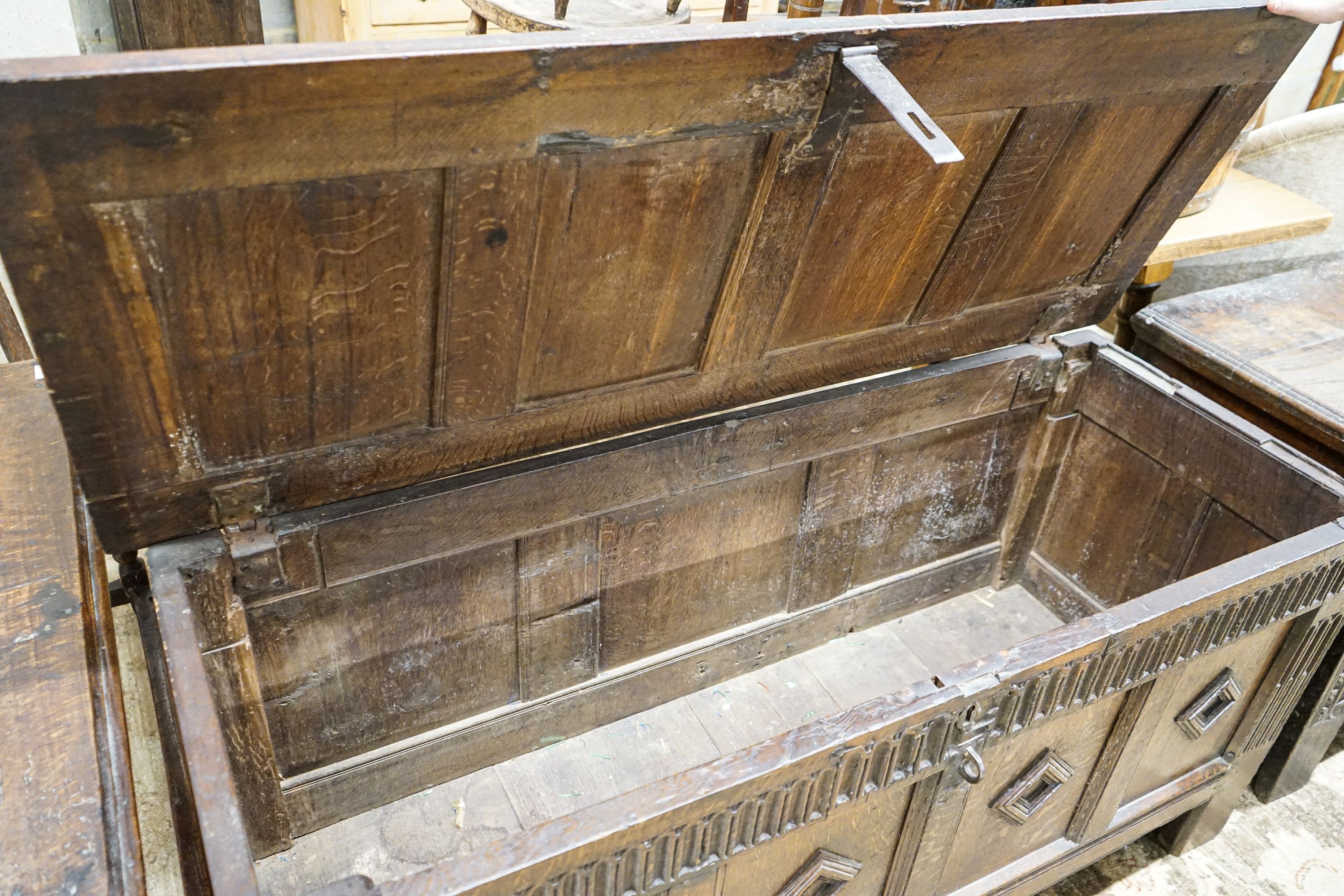 A late 17th century oak coffer, with four panel top and carved front, length 151cm, depth 58cm, - Image 3 of 6