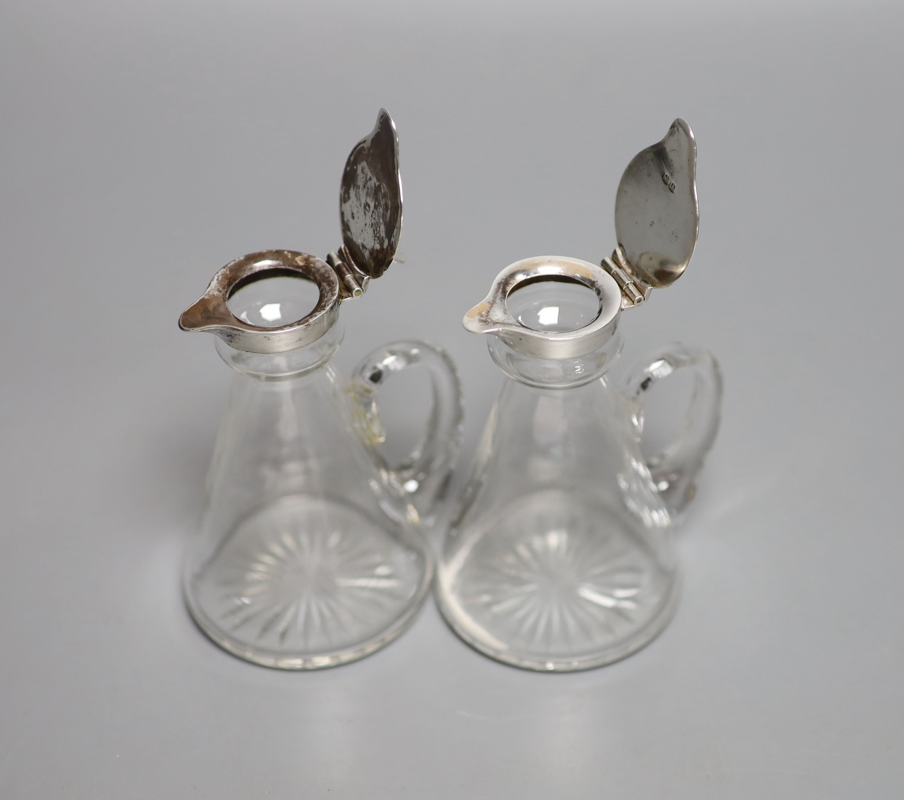 A pair of George V silver mounted glass whisky tot jugs, Hukin & Heath, Birmingham, 1925, 11.5cm. - Image 2 of 3