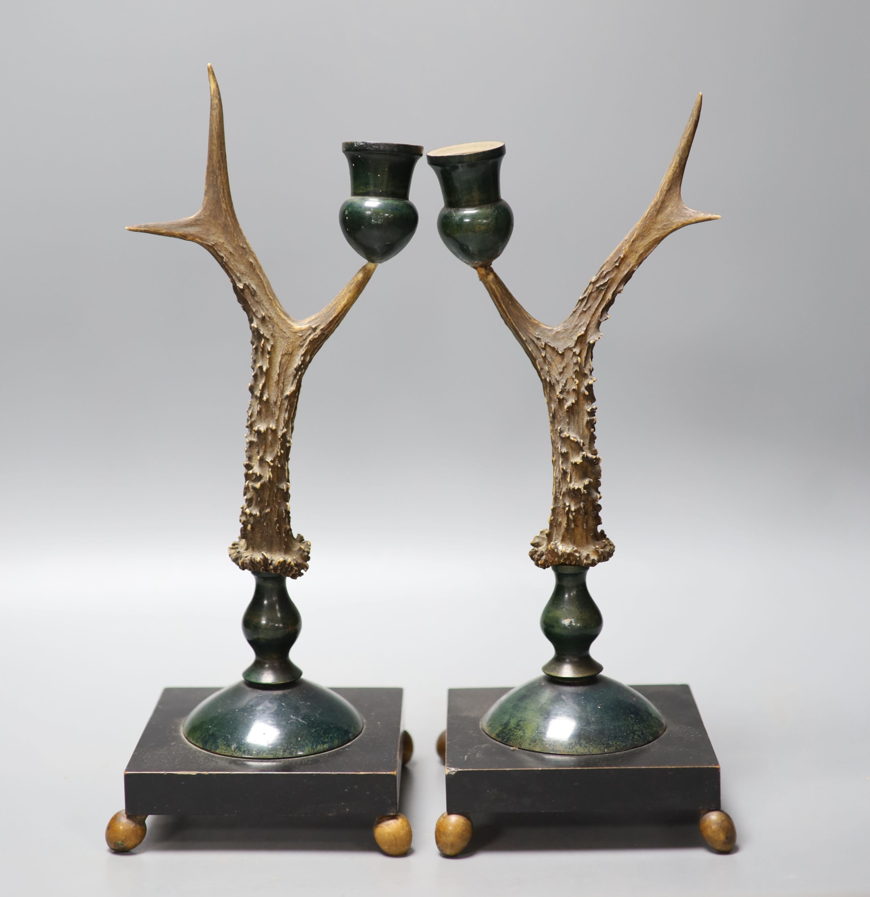 A pair of late 19th/early 20th century antler candlesticks, 34.5cm