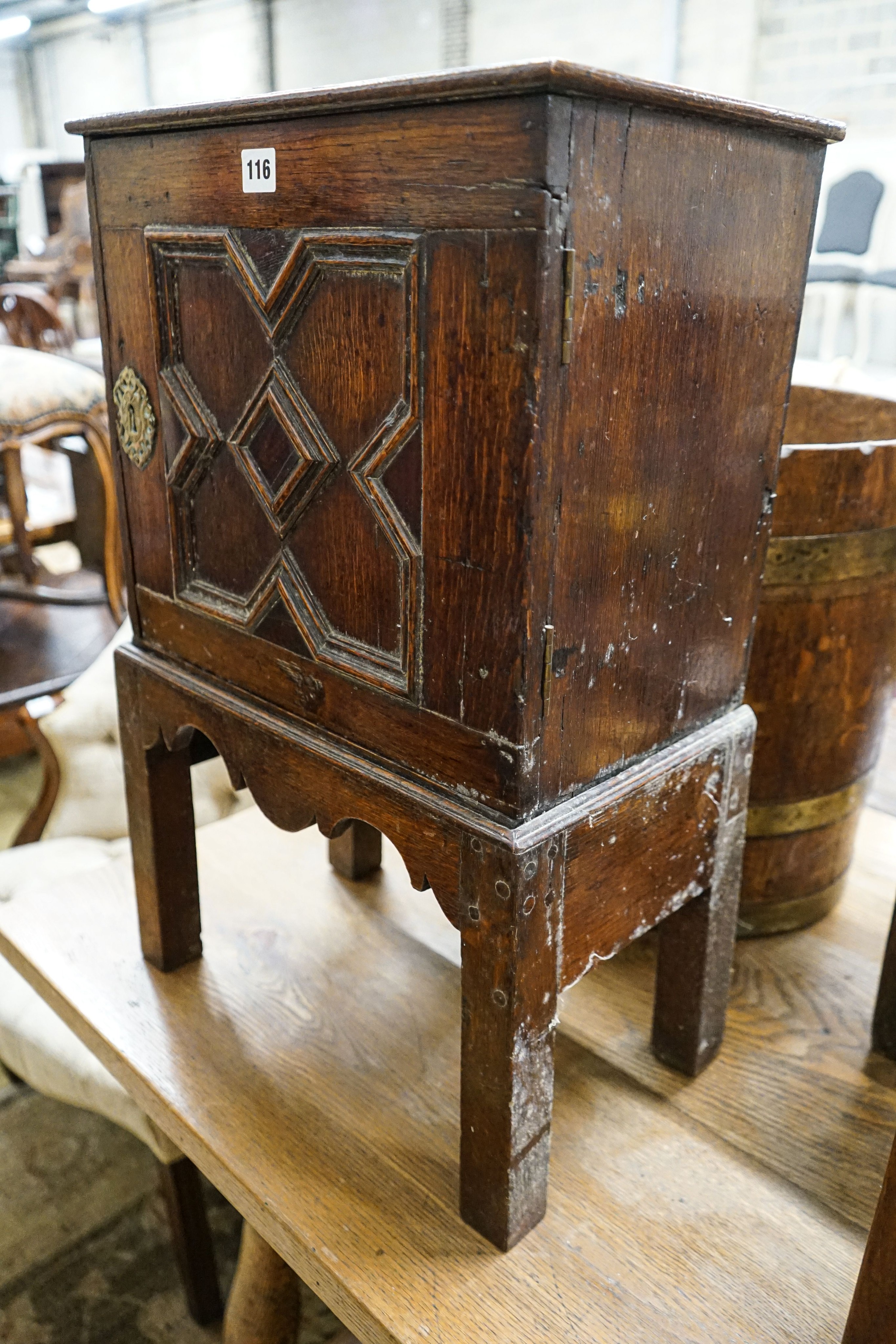 A late 17th century oak spice cupboard, with geometric panelled door enclosing five small drawers, - Image 6 of 6