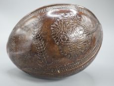 A 19th century carved coconut, 14 cm