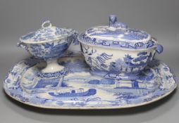 A group of 19th century blue and white pottery to include a chinoiserie pattern meat plate, 53.5 cm,