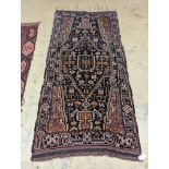 A Caucasian design blue ground rug, 224 x 111cm