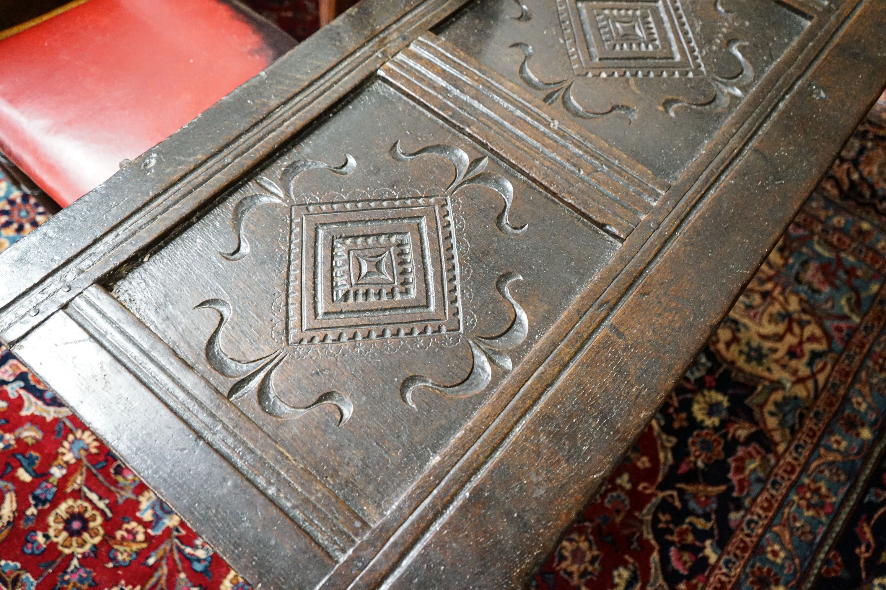 A late 17th/early 18th century carved and panelled oak coffer with hinged lid, width 136cm, depth - Image 3 of 7