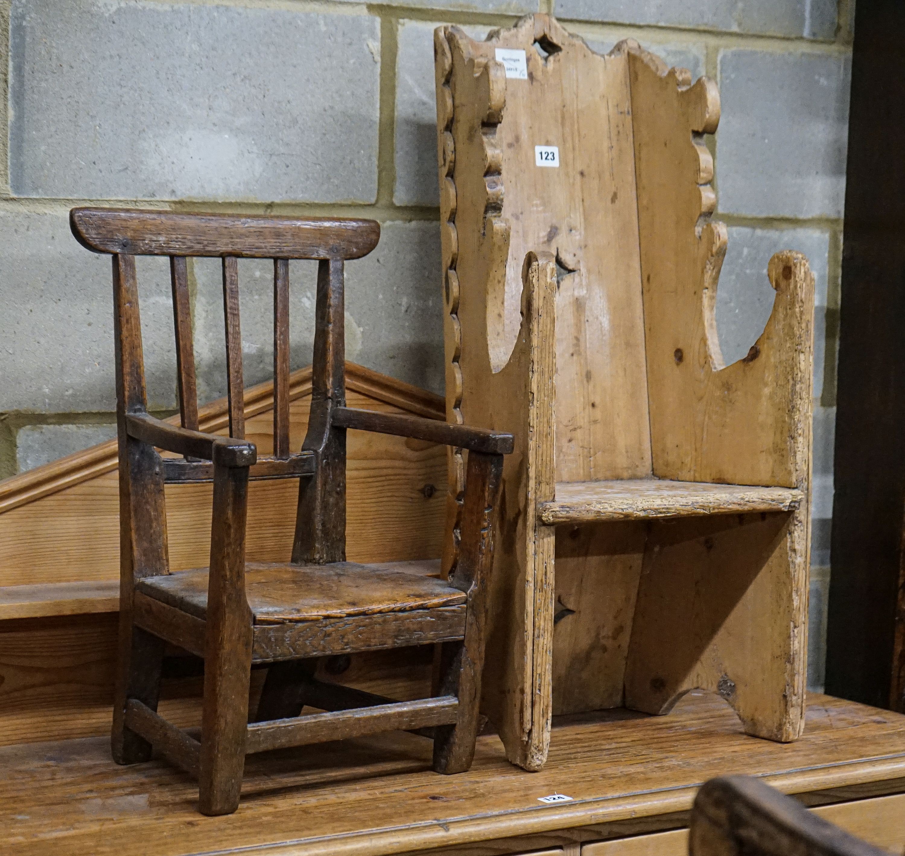 An early 19th century primitive oak child's chair with solid seat, width 39cm height 56cm and a