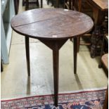 A George III oak cricket table, with circular top on tapered triangular legs, diameter 71cm height