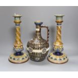 A pair of Doulton Lambeth stoneware candlesticks, height 30cm, and a similar 1878 ewer (cracked)