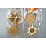 Four U.S. forces unnamed military medals to include -a USAF DFC, NDSM, Vietnam Campaign Medal and