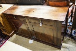 A Regency mahogany low cabinet fitted with two drawers, over a pair of cupboard doors and plinth