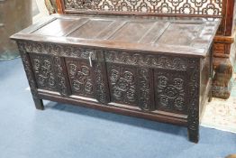 A 17th century Gloucestershire area carved, panelled oak coffer, length 150cm, depth 58cm, height