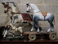 A Victorian carved and painted wood rocking horse, lacking underframe, length 77cm and two painted