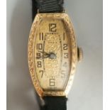 A lady's early 20th century 18ct gold manual wind wrist watch, case diameter 17mm, on a sash strap