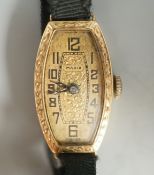 A lady's early 20th century 18ct gold manual wind wrist watch, case diameter 17mm, on a sash strap