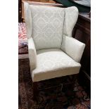 A George III oak child's upholstered wing armchair, width 52cm, depth 41cm, height 84cm