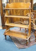 A late 19th century mahogany campaign four tier open bookcase by Ross and Co. Dublin, width 98cm,