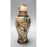 A late 19th century Chinese crackle glaze famille rose baluster vase and cover30cm