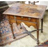 An early 18th century oak lowboy, with single drawer and saltire stretcher, width 67cm, depth