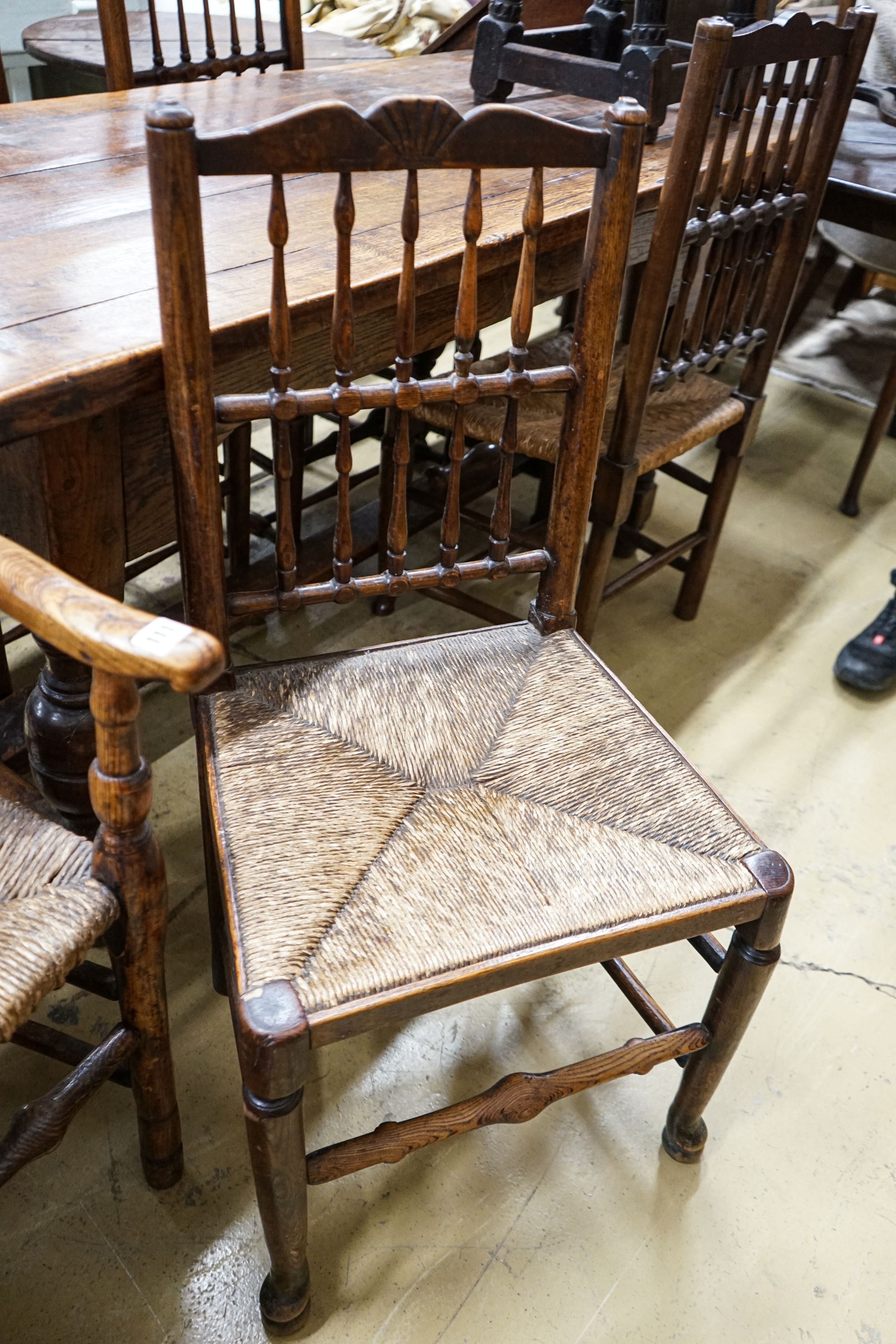 A harlequin set of five oak, elm and beech spindle back chairs, with rush seats and a similar - Image 3 of 4