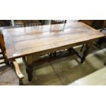 A 17th century style oak refectory table, with cup and cover legs and H stretcher, length 177, depth