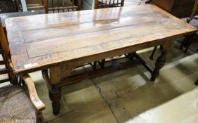 A 17th century style oak refectory table, with cup and cover legs and H stretcher, length 177, depth