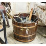 A copper bound staved oak log bin, sundry trivets and fire irons, width over handles 62cm