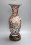 A large 20th century Japanese Arita porcelain vase, wood stand, restored 50cm