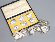A set of four Victorian silver leaf shaped wine labels, London, 1874, 64mm, one other Victorian