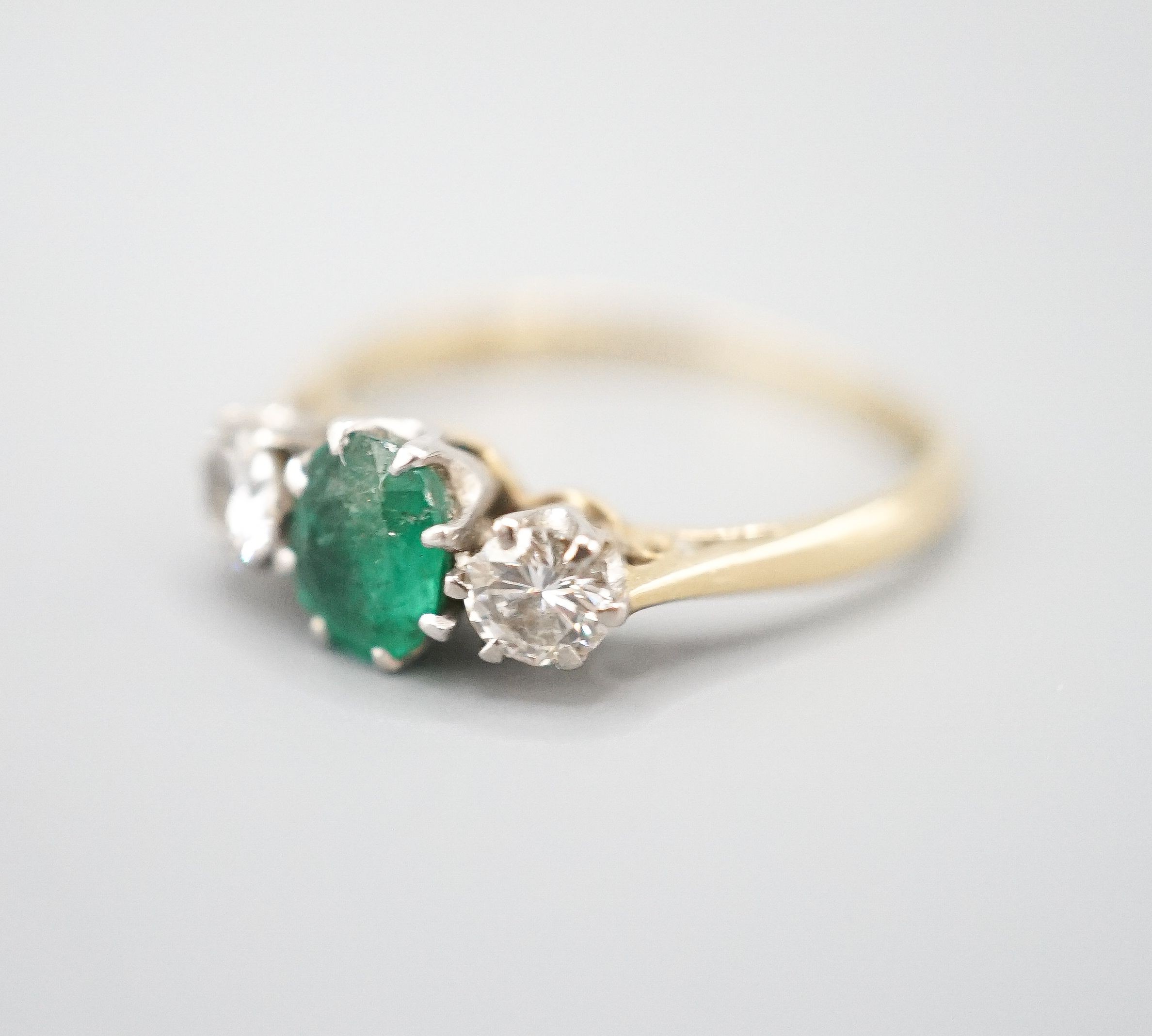 An 18ct and plat, emerald and diamond set three stone ring, size K, gross weight 2.3 grams. - Image 3 of 5