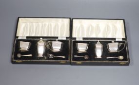 Two modern cased three piece silver condiment sets,