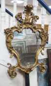 An 18th century Italian carved giltwood cartouche wall mirror, width 53cm, height 76cm