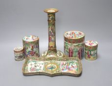 A Chinese Canton famille rose nest of boxes and covers, a similar candlestick and a tray 23cm