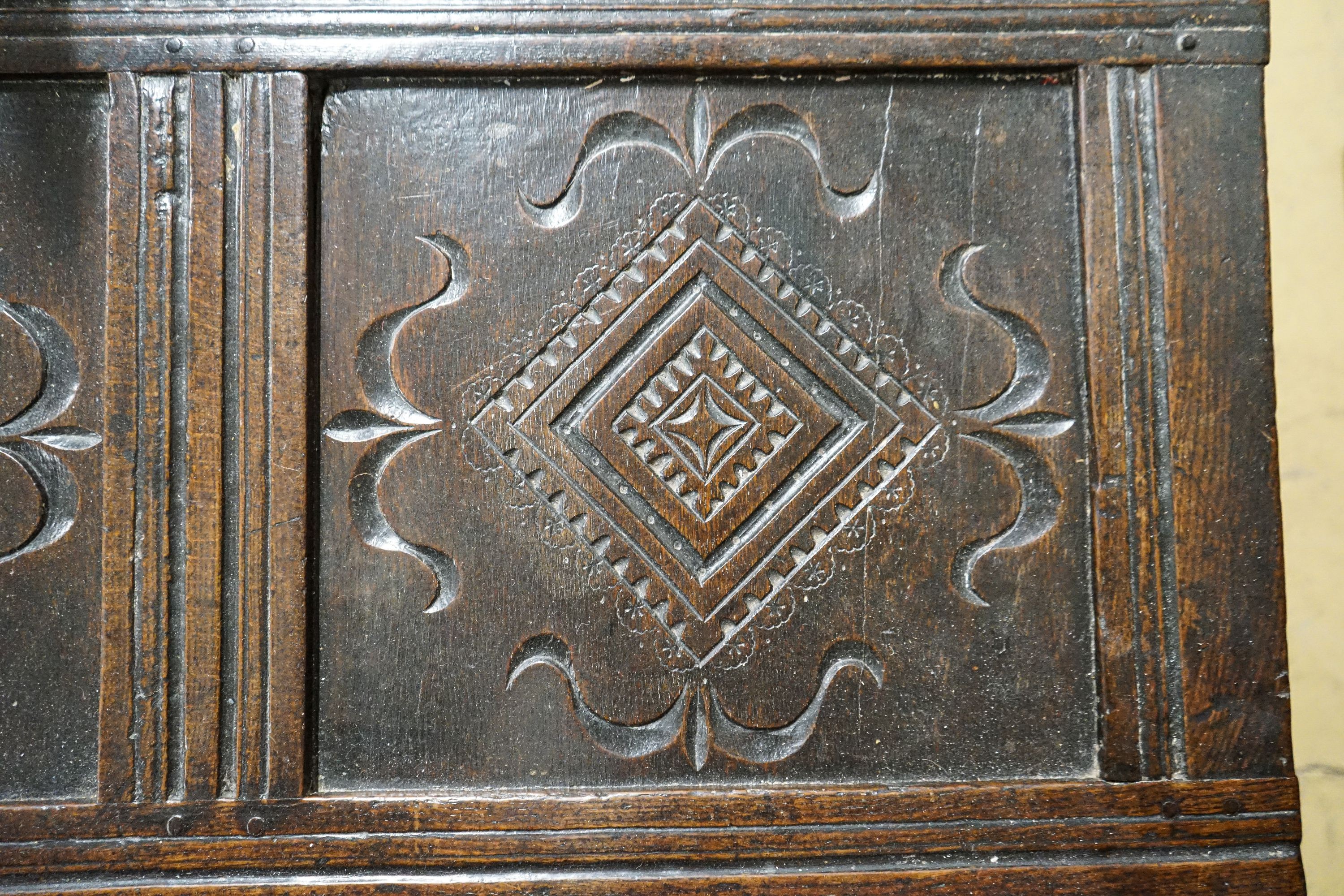 A late 17th/early 18th century carved and panelled oak coffer with hinged lid, width 136cm, depth - Image 7 of 7