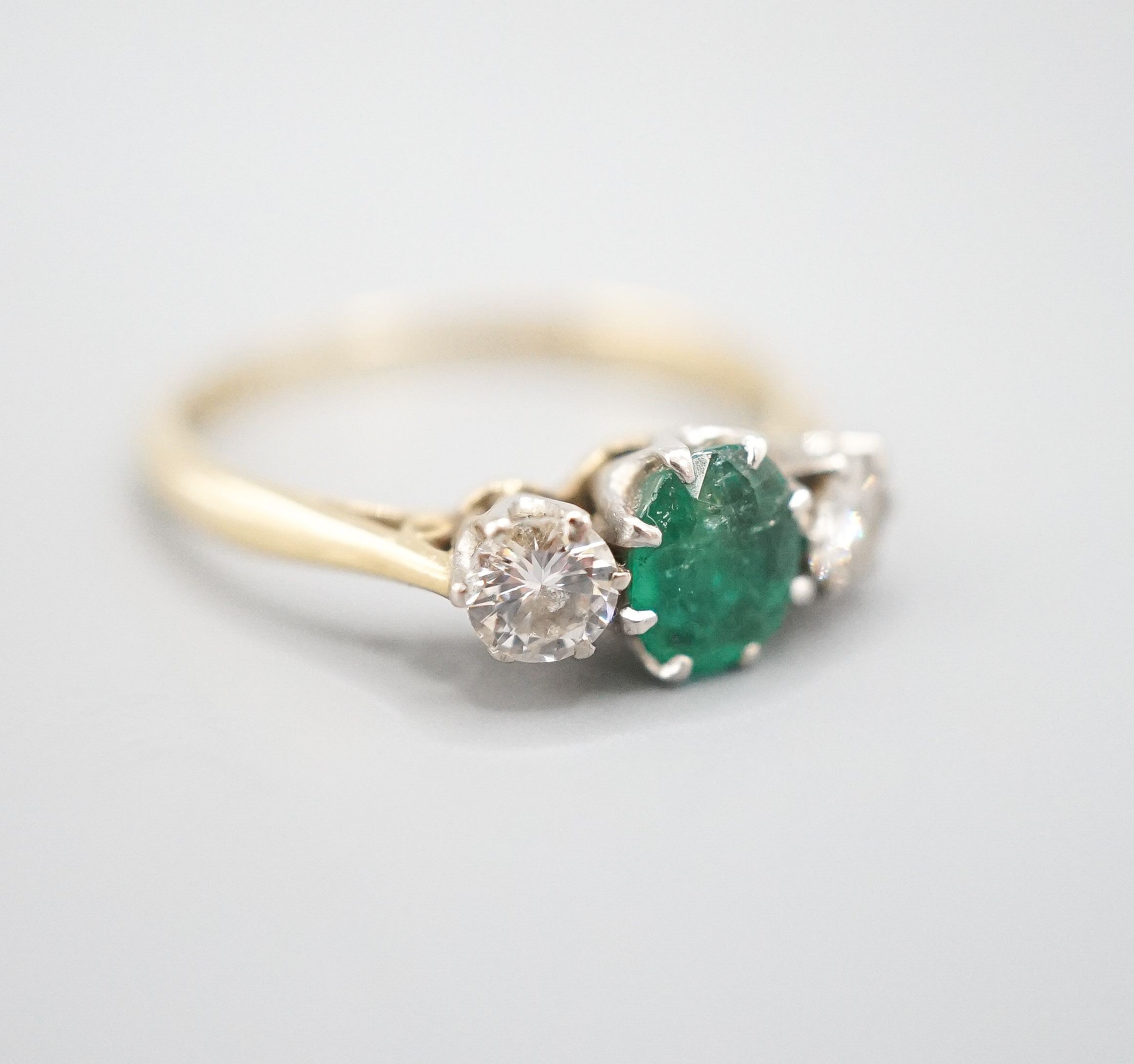 An 18ct and plat, emerald and diamond set three stone ring, size K, gross weight 2.3 grams. - Image 2 of 5