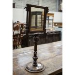 An antique stained beech and walnut telescopic shaving mirror, with barber's pole stringing,