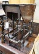 An unusually small late 17th century style mahogany gateleg table, with oval top and inverted cup