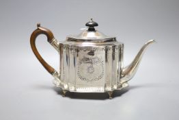 A George III bright cut engraved oval teapot and matching stand, Soloman Hougham, London, 1794,