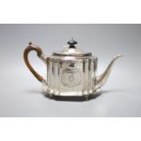 A George III bright cut engraved oval teapot and matching stand, Soloman Hougham, London, 1794,