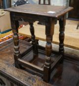 A 17th century style oak joint stool, with turned legs and carved apron, width 46cm, depth 27cm,