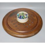 A collection of glass marbles and a mahogany solitaire board 45cm