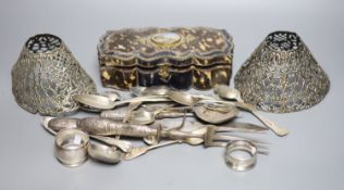 A group of assorted silver flatware and other items, including teaspoons, napkin ring, pierced