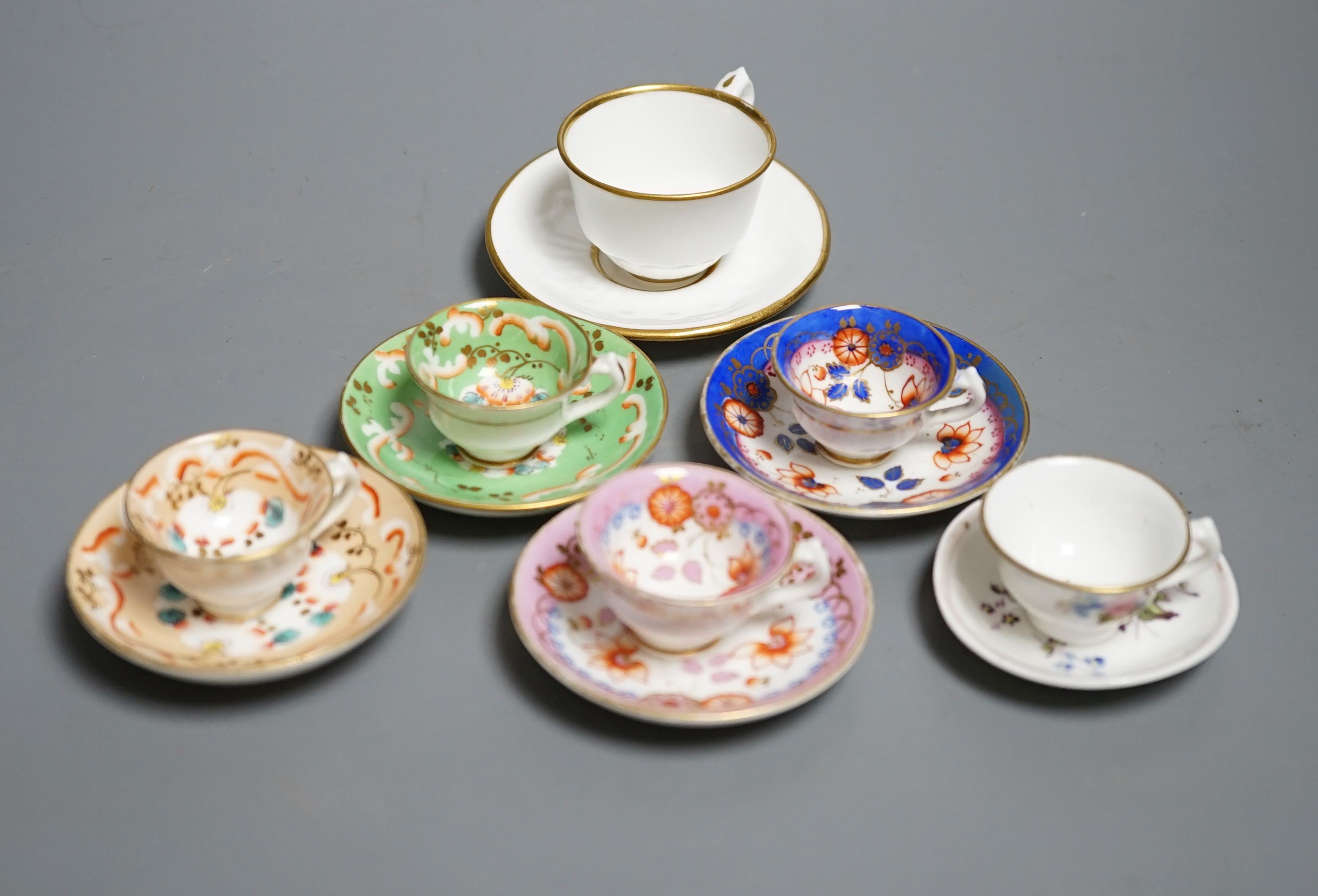 Five Staffordshire miniature teacups and saucers, possibly Alcock and a Hicks & Meigh miniture