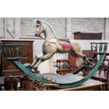 A large Victorian style painted rocking horse with end seats, length 240cm, height 132cm