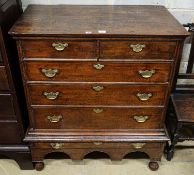 An early 18th century oak chest on stand, fitted two short and four long drawers, width 106cm, depth