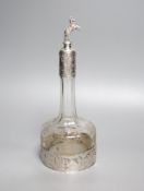 A late 19th/early 20th century Hanau? white metal mounted glass decanter, with rearing horse mounted