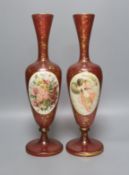 A pair of 19th century Bohemian enamelled and overlaid ruby glass vases 36cm